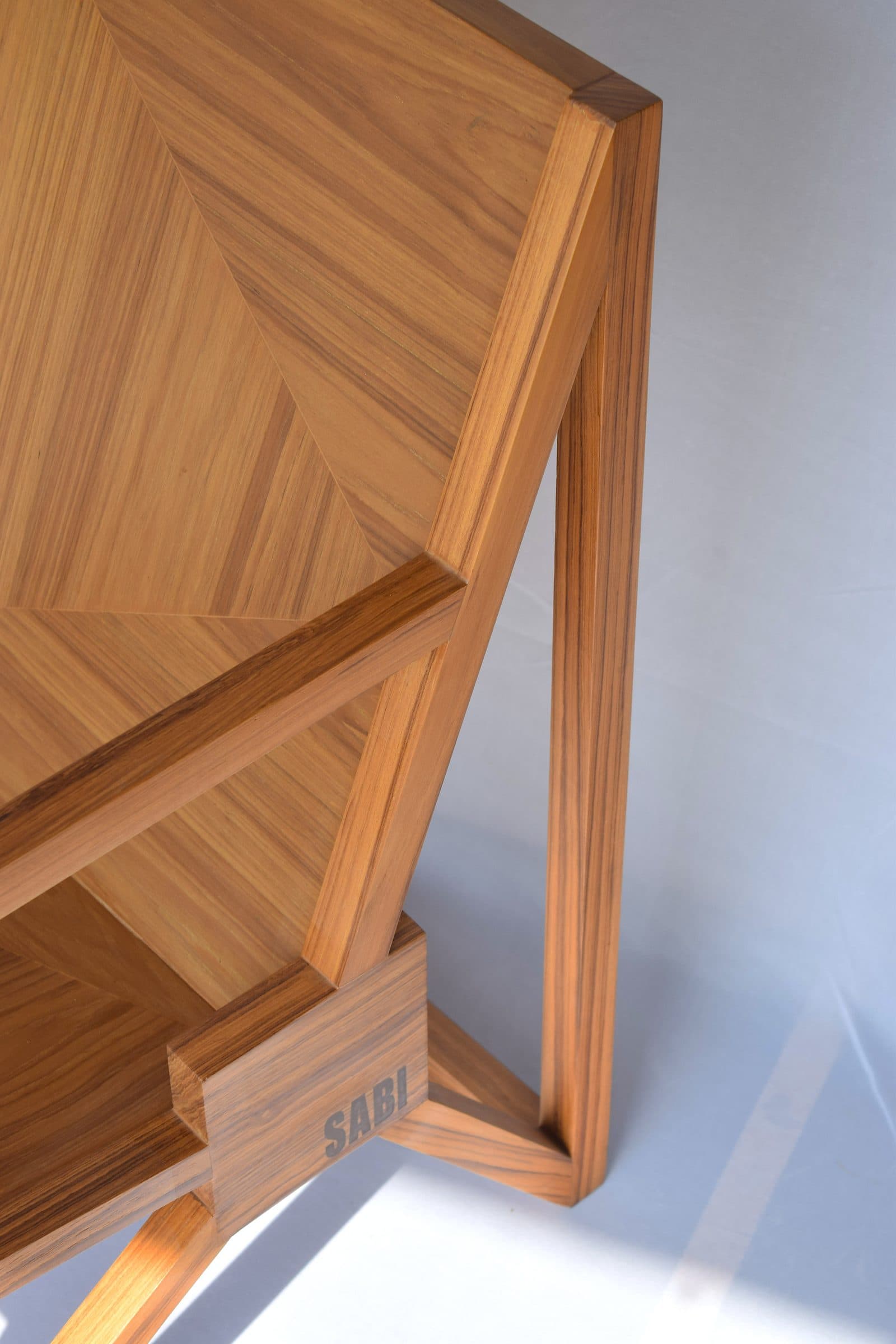 The Infinite Chair in solid teak, full height